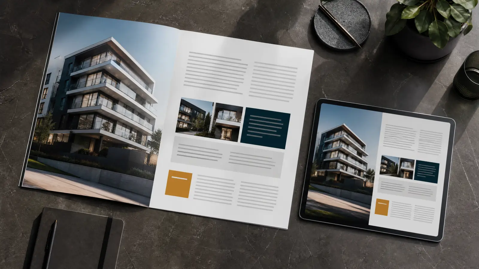 Printed property exposé and a tablet with the same layout on a stone table